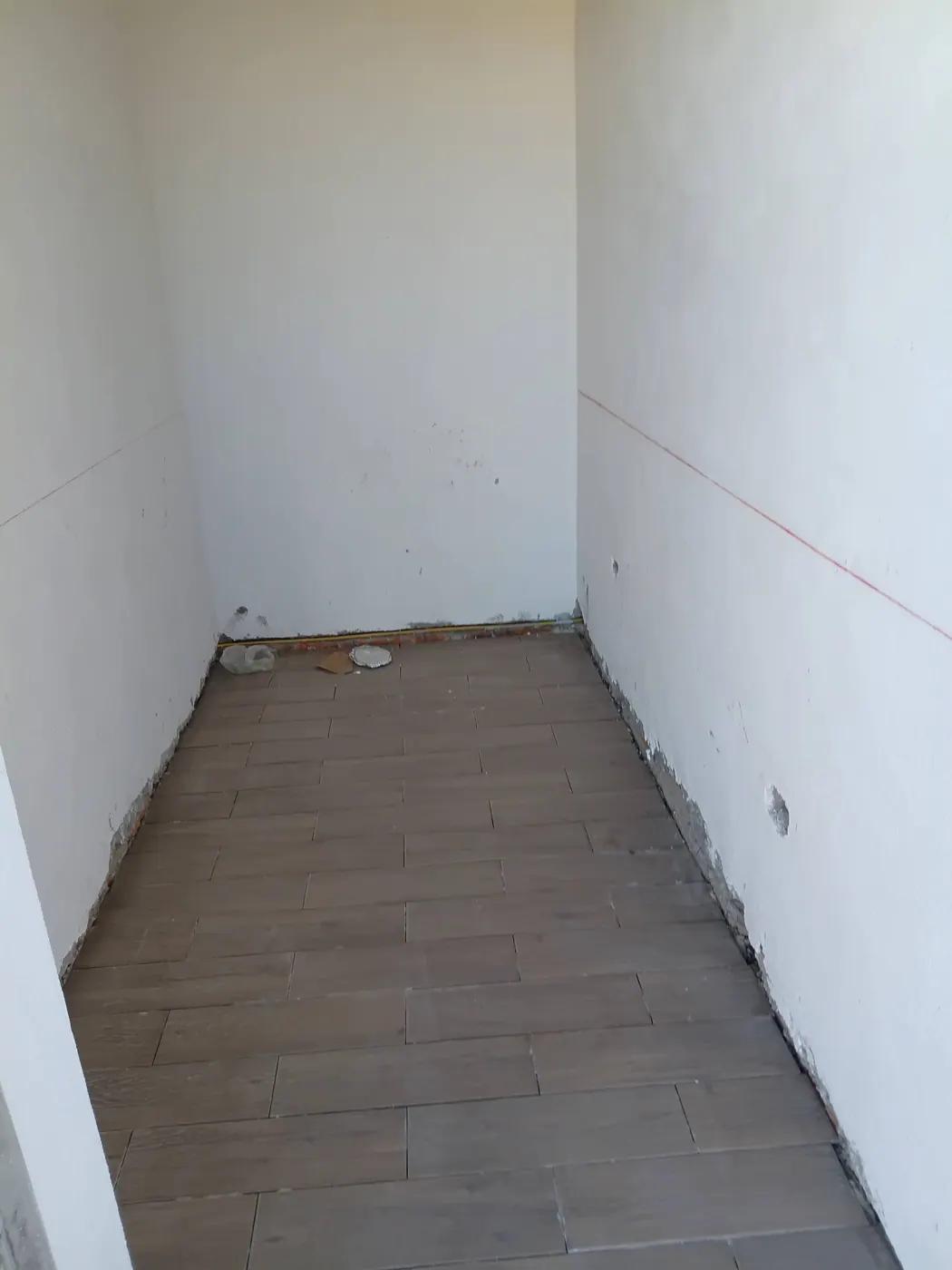 New floor surface and unfinished wall — October 20