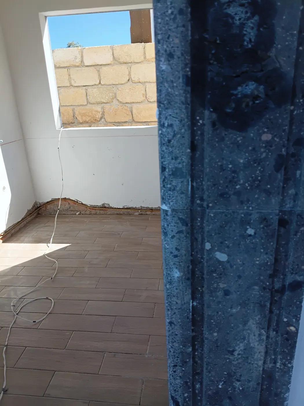 Tile installation in laundry room — October 20